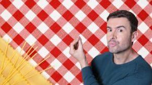 Italian culture shown by a young man making the Italian “boh” hand gesture at a traditional trattoria table