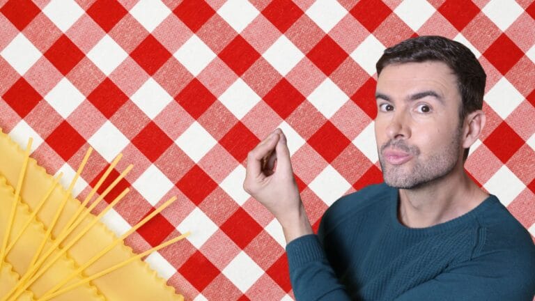 Italian culture shown by a young man making the Italian “boh” hand gesture at a traditional trattoria table